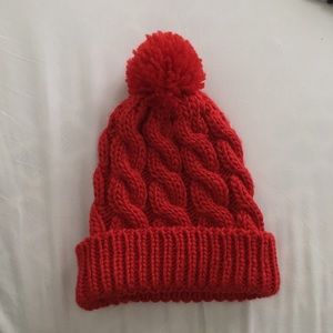 Red knit beanie with pom pom